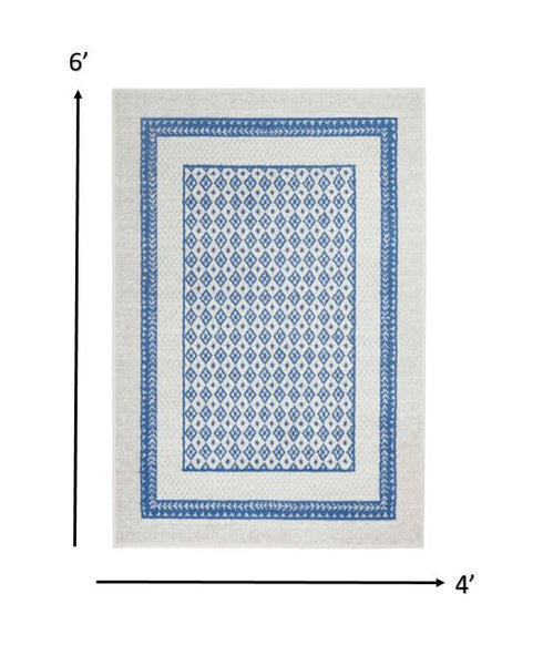 Ivory and Blue Geometric Area Rug